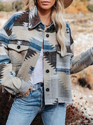 Geometric button-up jacket in Peacock Blue with frayed details and chest pockets.