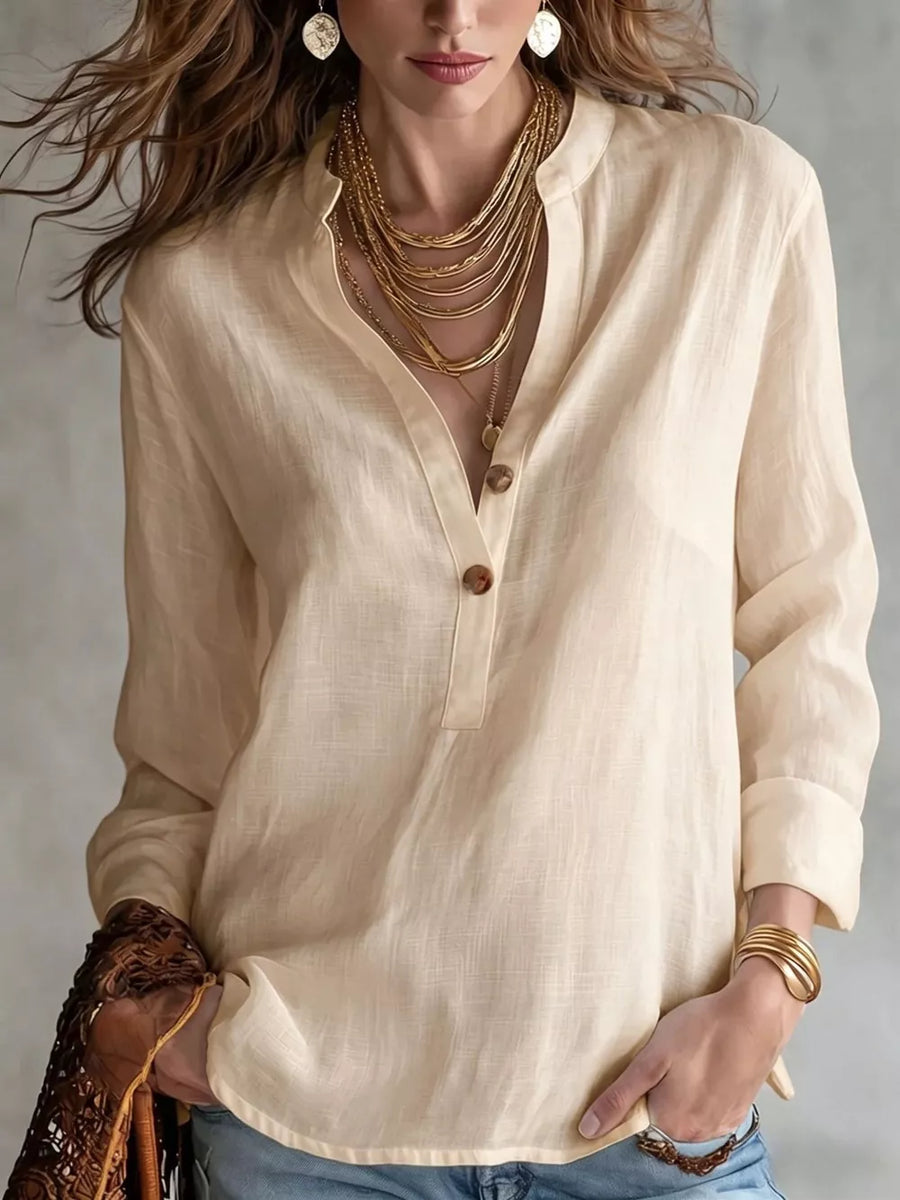 blush pink blouse with roll-tab sleeves and long sleeve