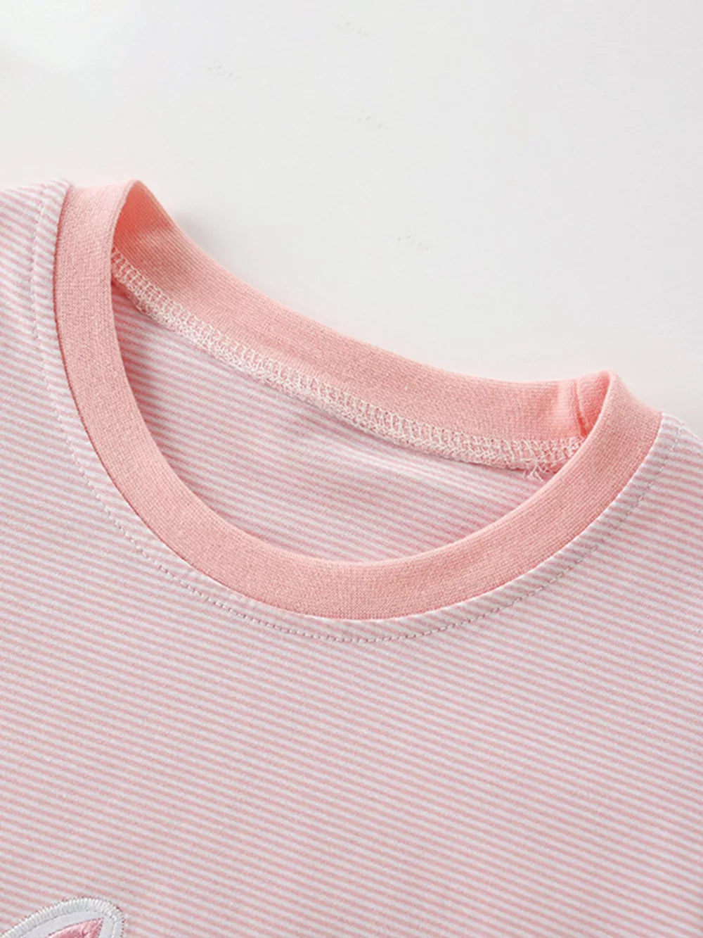 Pink striped cotton t-shirt with applique detail and contrast neckline.