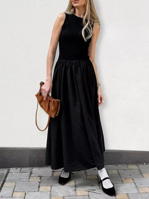80% polyester, 20% spandex Care instructions: Machine wash cold maxi dress in Black with A-line silhouette