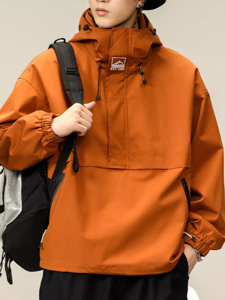 Orange hooded windbreaker jacket with drawstring hood and elastic cuffs.