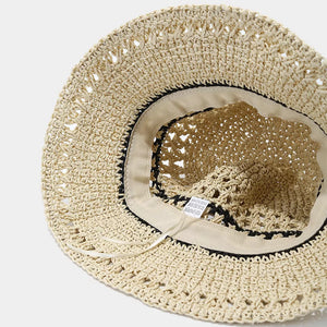 hat in black with striped and woven texture