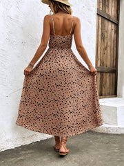 Taupe floral print spaghetti strap midi dress with adjustable straps and a-line cut.