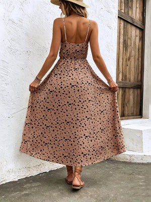 Taupe floral print spaghetti strap midi dress with adjustable straps and a-line cut.