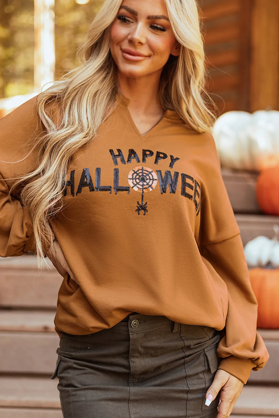 Caramel Halloween graphic sweatshirt with sequin spiderweb and spider detail.