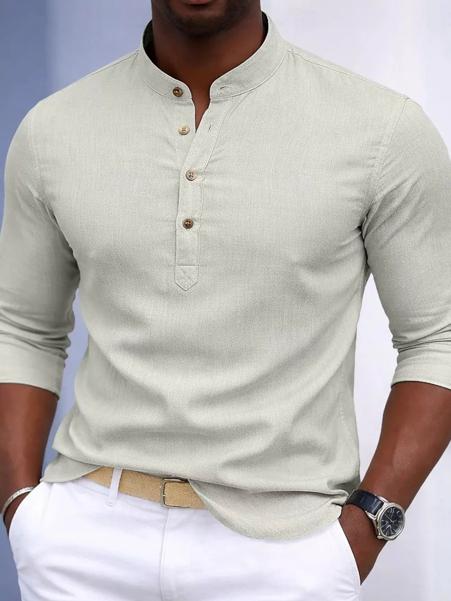 Men's slim fit henley shirt in light sage cotton blend with button detail.