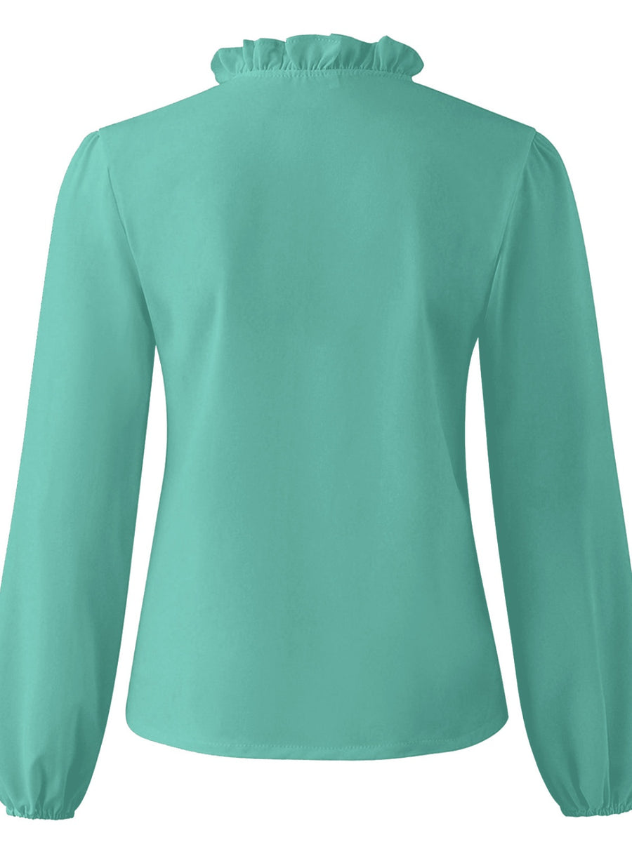 Teal blouse with ruffled neckline and balloon sleeves.