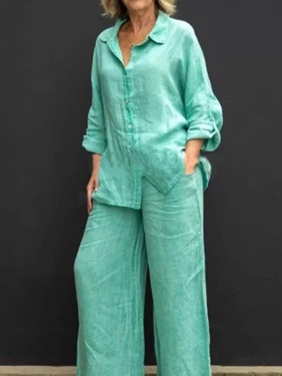 Relaxed two-piece set in sky blue with buttoned collared top and wide-leg pants.