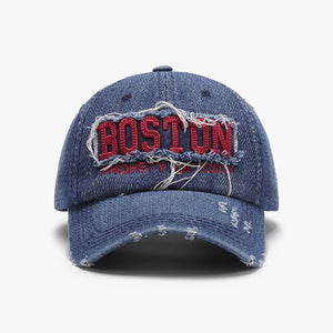 Distressed denim baseball cap with red embroidered Boston text and frayed details.
