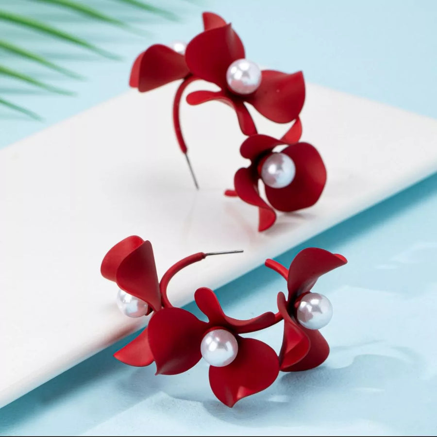 Red floral pearl hoop earrings with matte finish.