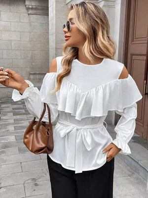 White ruffled cold shoulder maternity blouse with tie belt and bell sleeves.