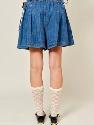 Dark blue denim-effect shorts with ruched waist and tie detail.