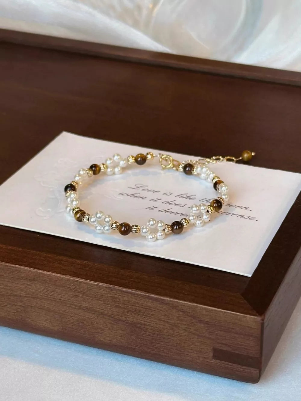 bracelet in ivory featuring beaded and fitted fit
