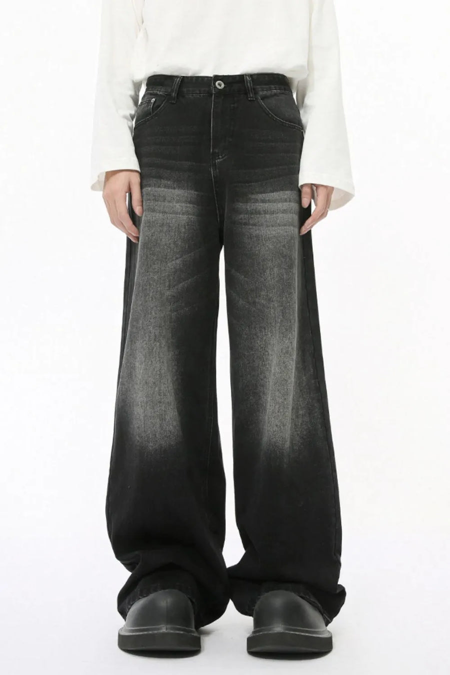 Black faded wash balloon leg jeans with a wide silhouette.