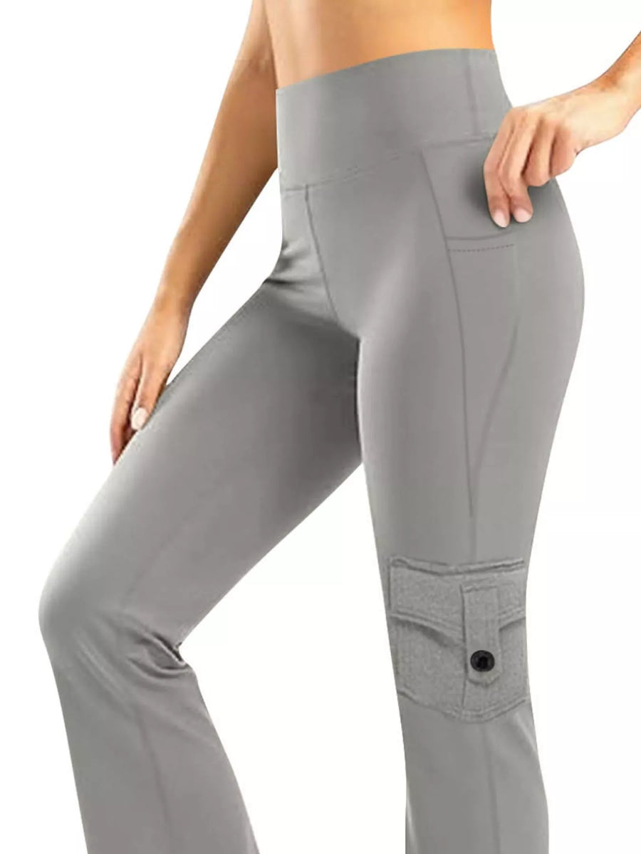 Gray pocketed high-waisted yoga pants with a flared silhouette and a cargo pocket detail.