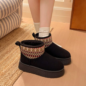black boots featuring platform sole and geometric