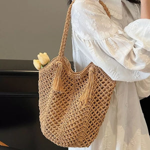 handbag in tan with crochet and tassel accents