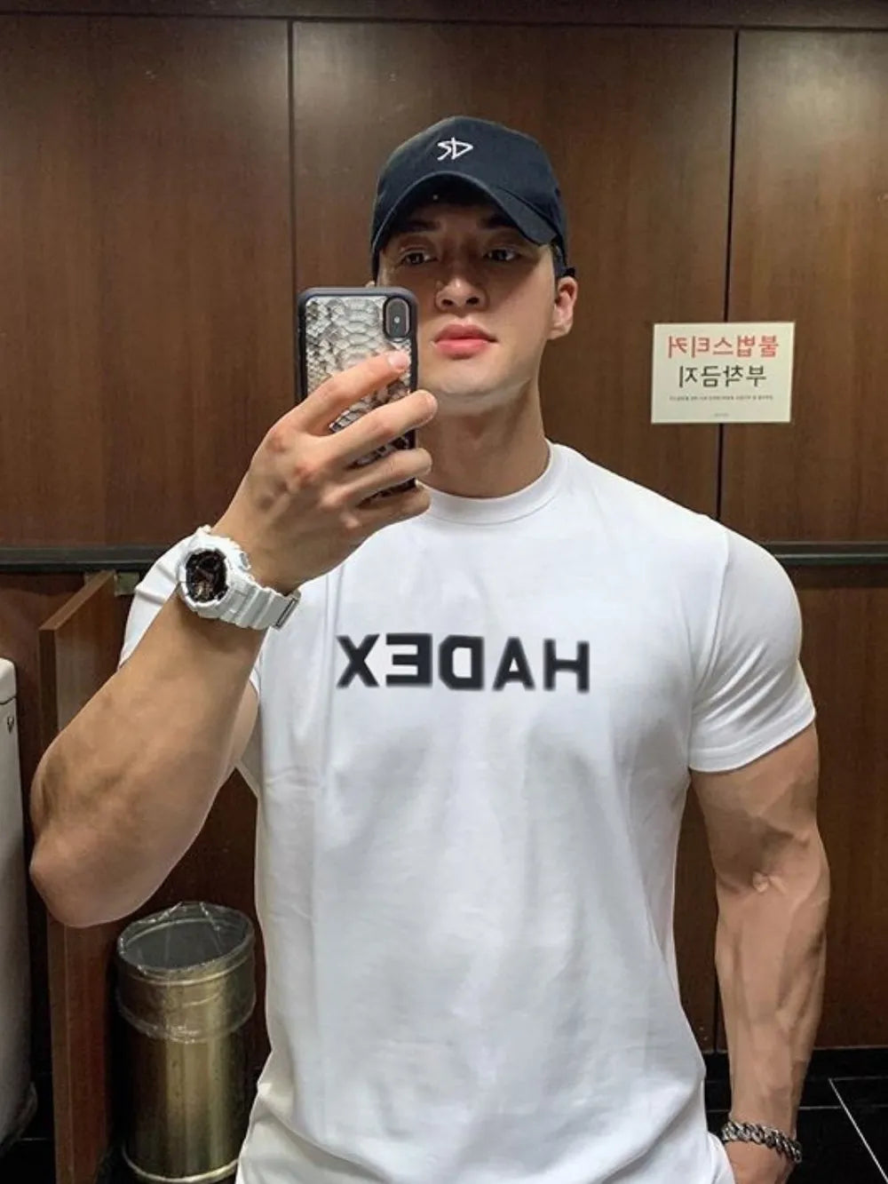 White crewneck t-shirt with reversed bold black graphic text on chest