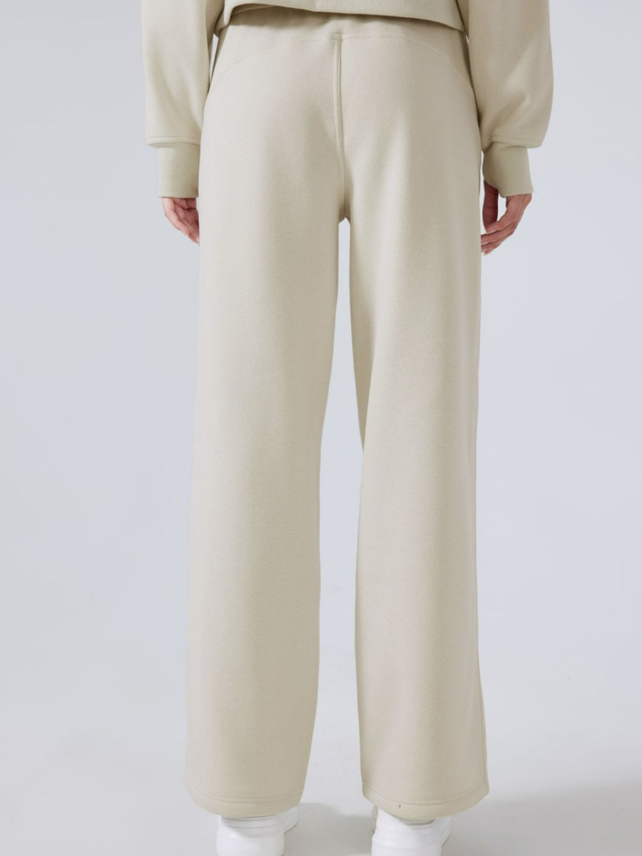 Beige relaxed fit palazzo sweatpants with drawstring waist and wide leg