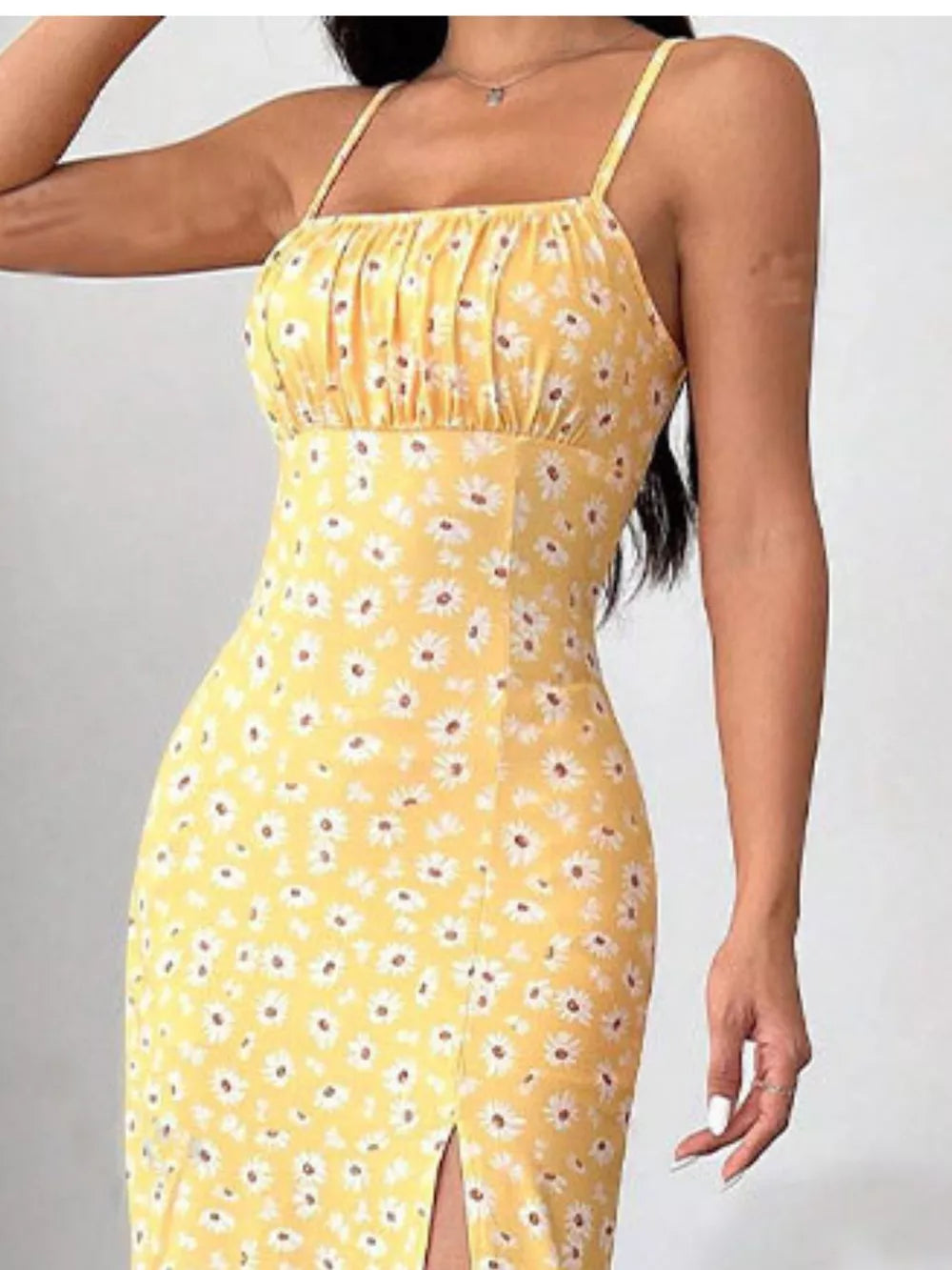 Yellow floral spaghetti strap midi dress with ruched bust and side slit.