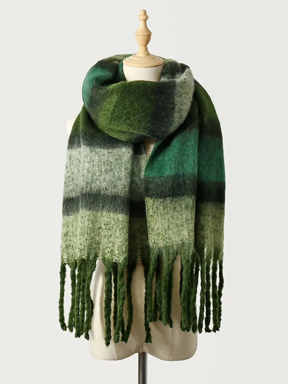 Ombre stripe scarf in dark green with tassels.