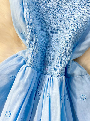 Blue eyelet maxi dress with smocked bodice and cutout detail