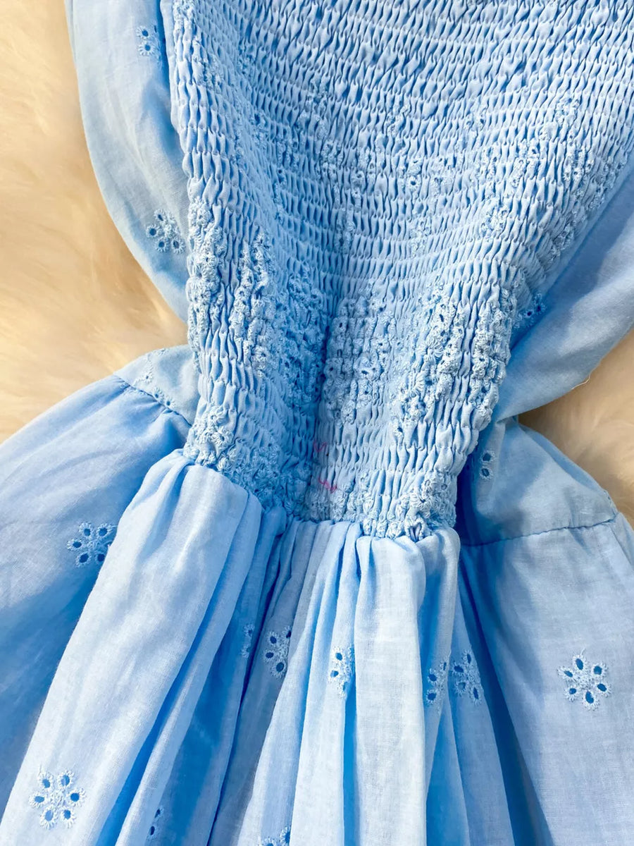 Blue eyelet maxi dress with smocked bodice and cutout detail