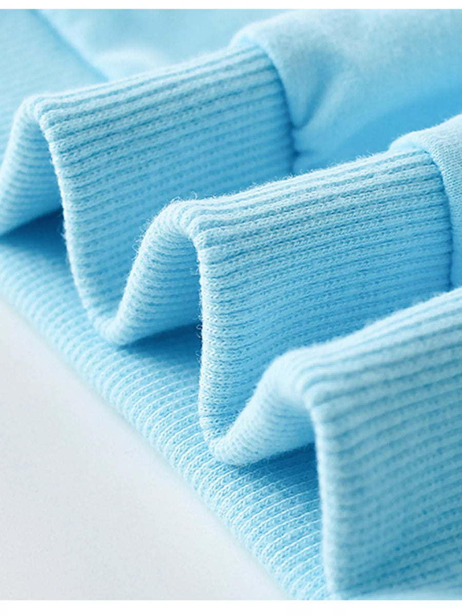 Pastel blue cotton crew neck sweatshirt with ribbed cuffs and hem detail.