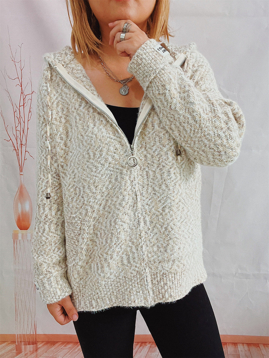 Speckled knit relaxed zip-up hoodie in a light neutral color with a herringbone pattern.