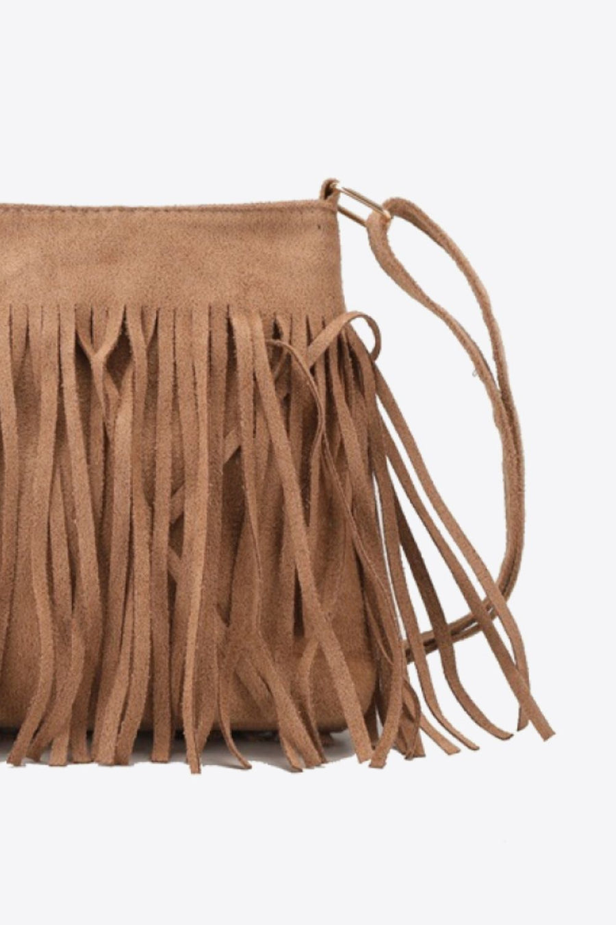 Caramel suede crossbody bag with fringe detail and adjustable strap.