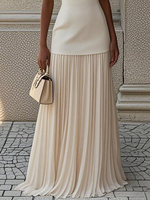Elegant white pleated maxi dress with a boat neck and a smooth bodice.