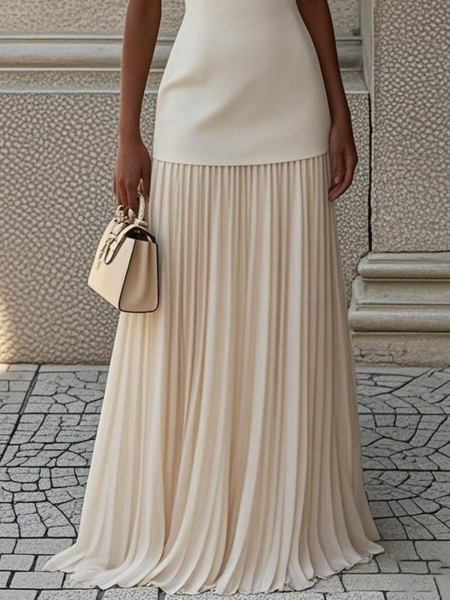 Elegant white pleated maxi dress with a boat neck and a smooth bodice.