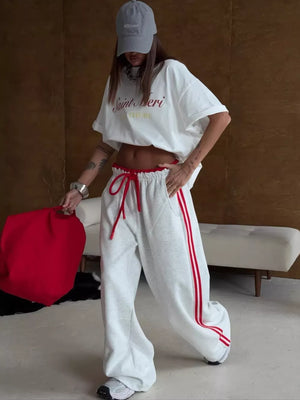 Red sweatpants with drawstring and striped