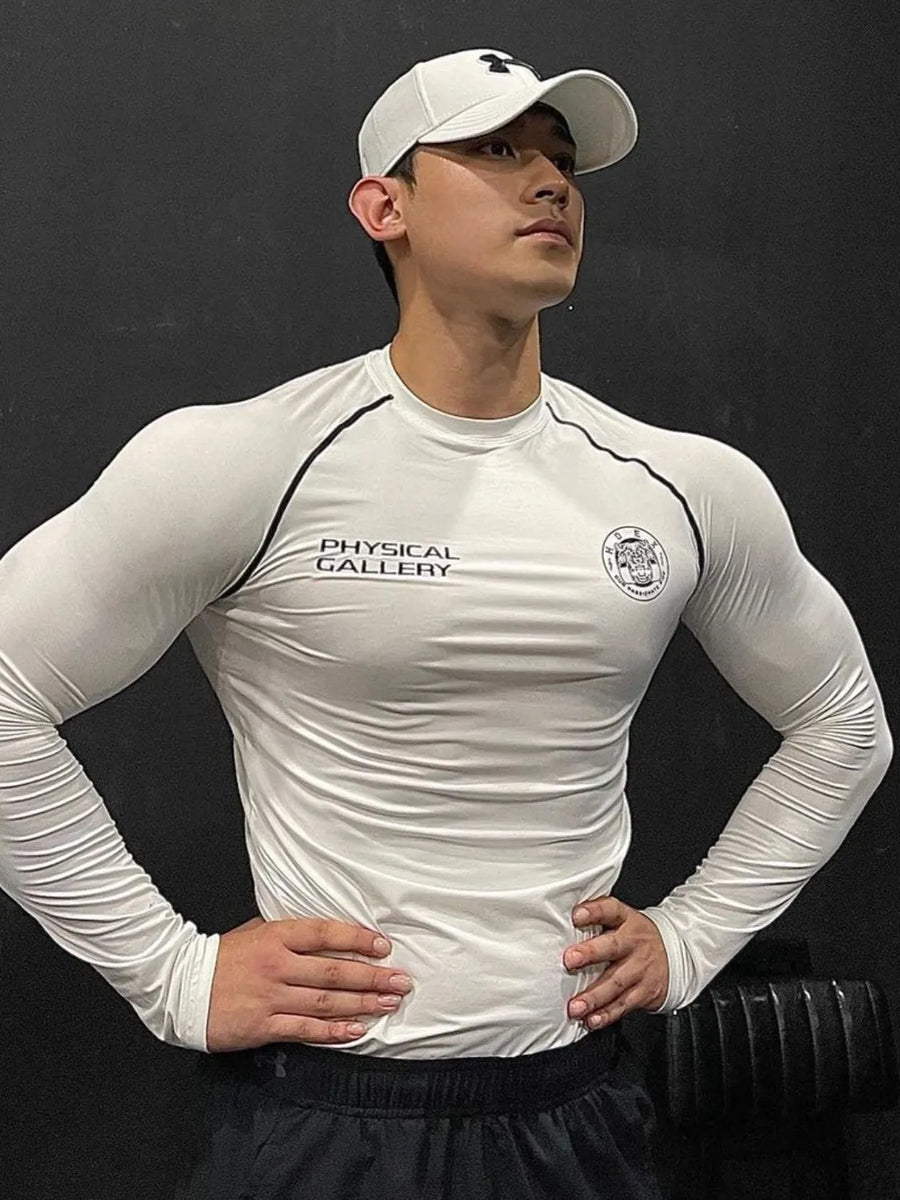 White crew neck long sleeve activewear shirt with black piping and chest branding.