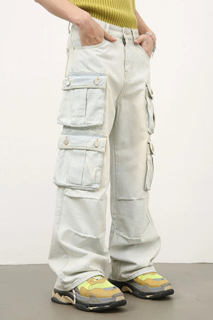 Light wash denim wide-leg cargo pants with pleated pockets.