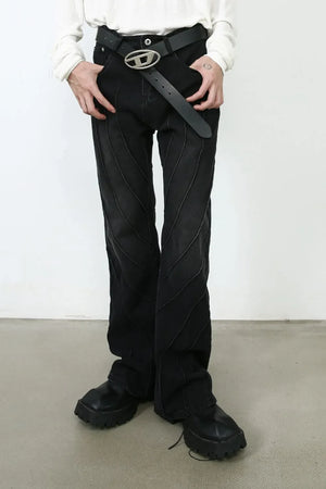 Dark denim flare trousers with chevron seams and a flared leg