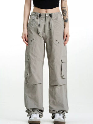 Relaxed fit grey cargo pants with multiple pockets and drawstring waist.