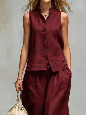 two-piece set in White with buttoned and hip-length top, full-length pants