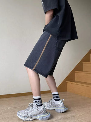 Men's black wide-leg denim shorts with side stripe detail and drawstring waist.