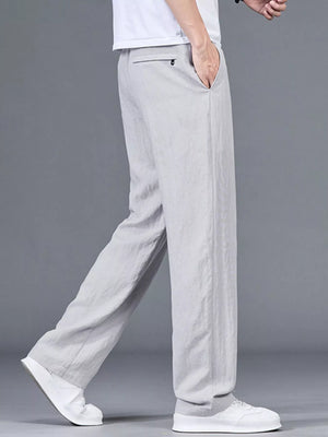 Plus-size linen gray casual trousers with drawstring and back pocket detail.