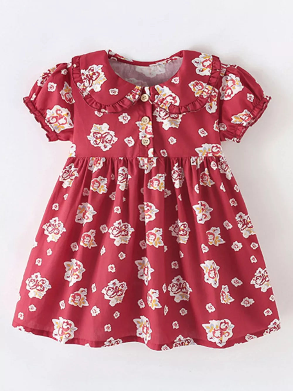 Red cotton baby dress with floral print, ruffle collar, puff sleeves, and button front.