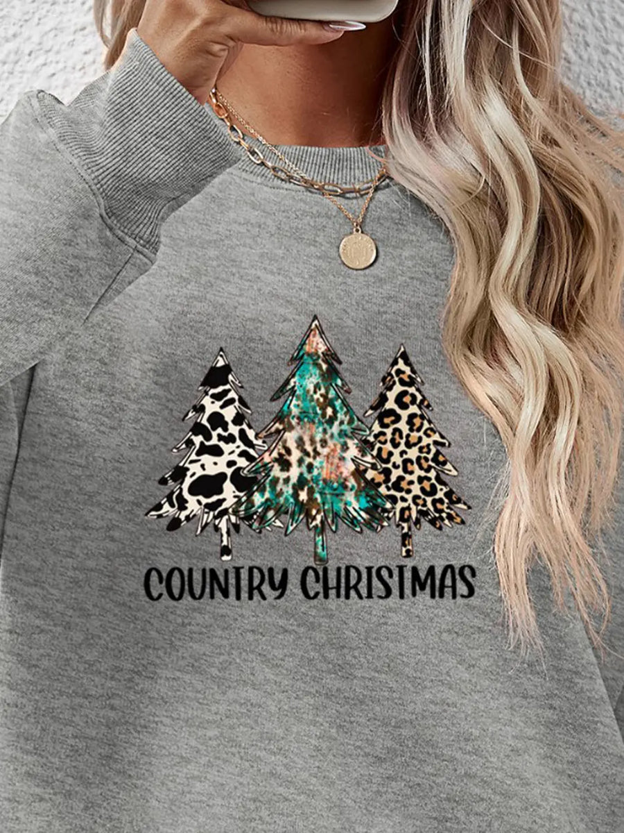 Gray graphic sweatshirt with country Christmas trees and text.