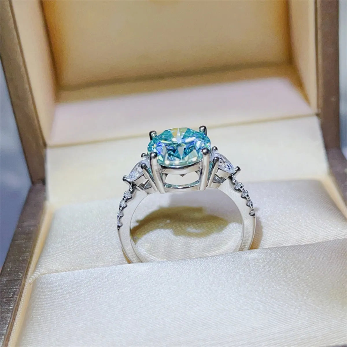 Turquoise moissanite trilogy ring in 925 sterling silver with pavé band