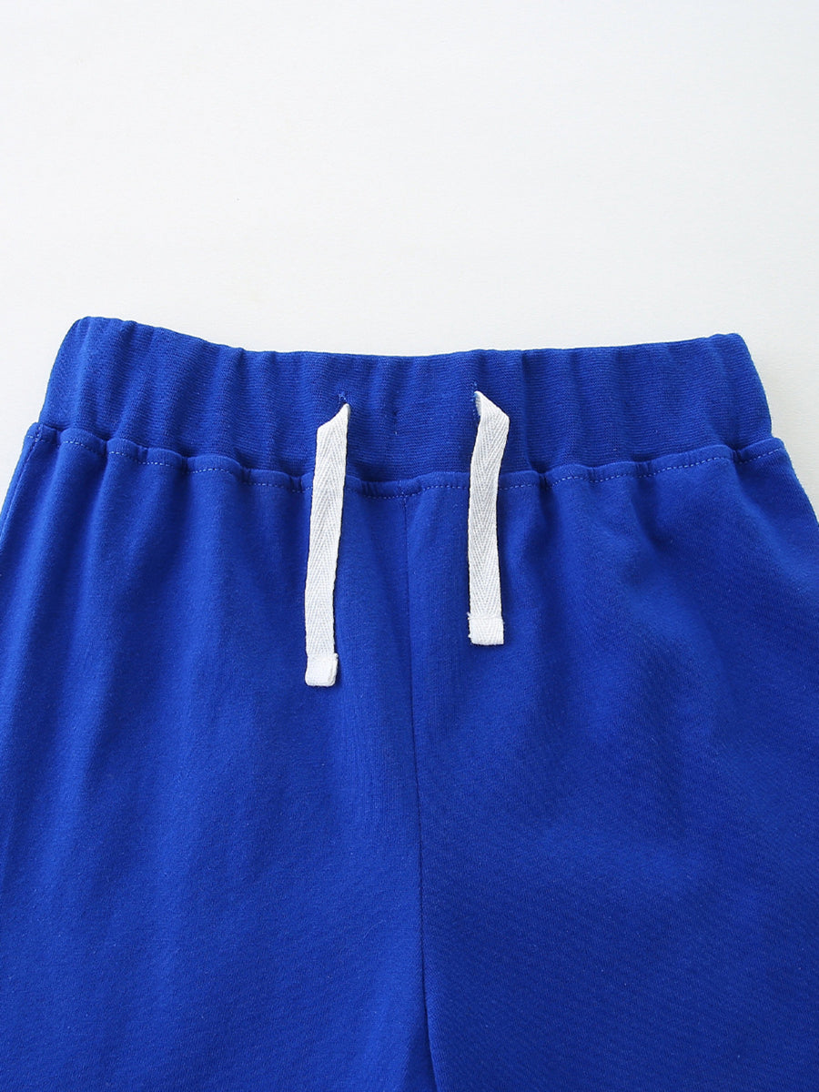 Blue cotton toddler shorts with elastic waistband and white drawstring.