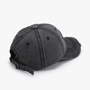 Black cotton baseball cap with distressed details and adjustable strap