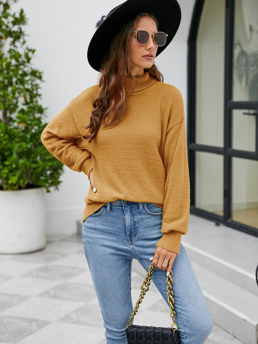 Textured mock neck knit sweater in honey, with long sleeves and a relaxed fit.