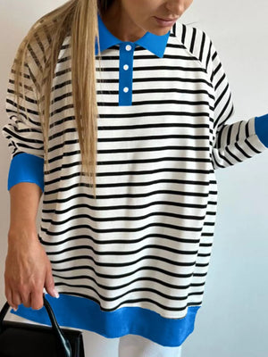 Polo collar long-sleeve sweatshirt with stripe pattern, blue collar and cuffs, and buttoned placket.