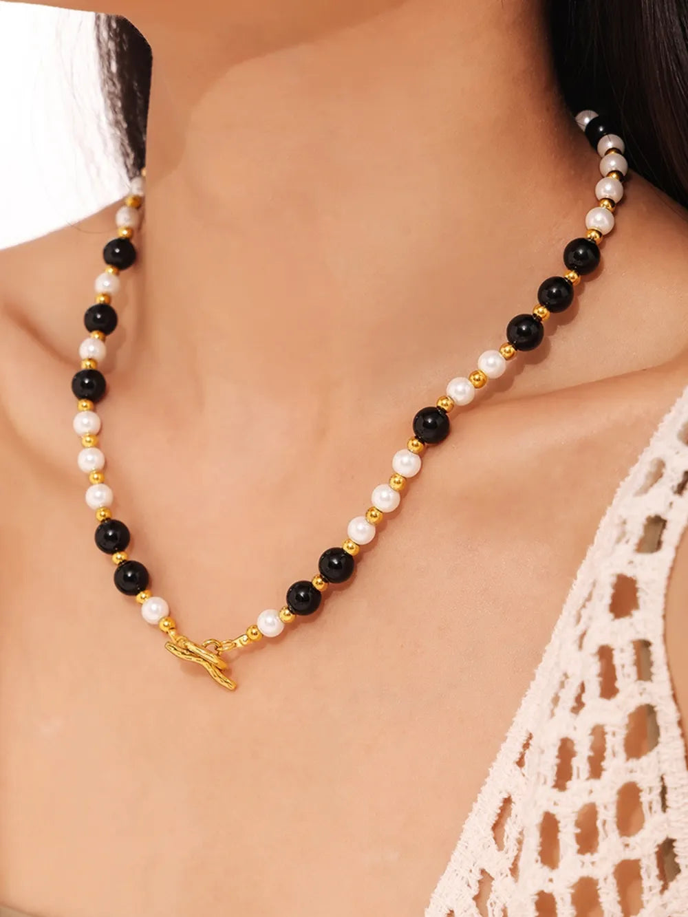 Gold toggle necklace with black onyx and pearl beads