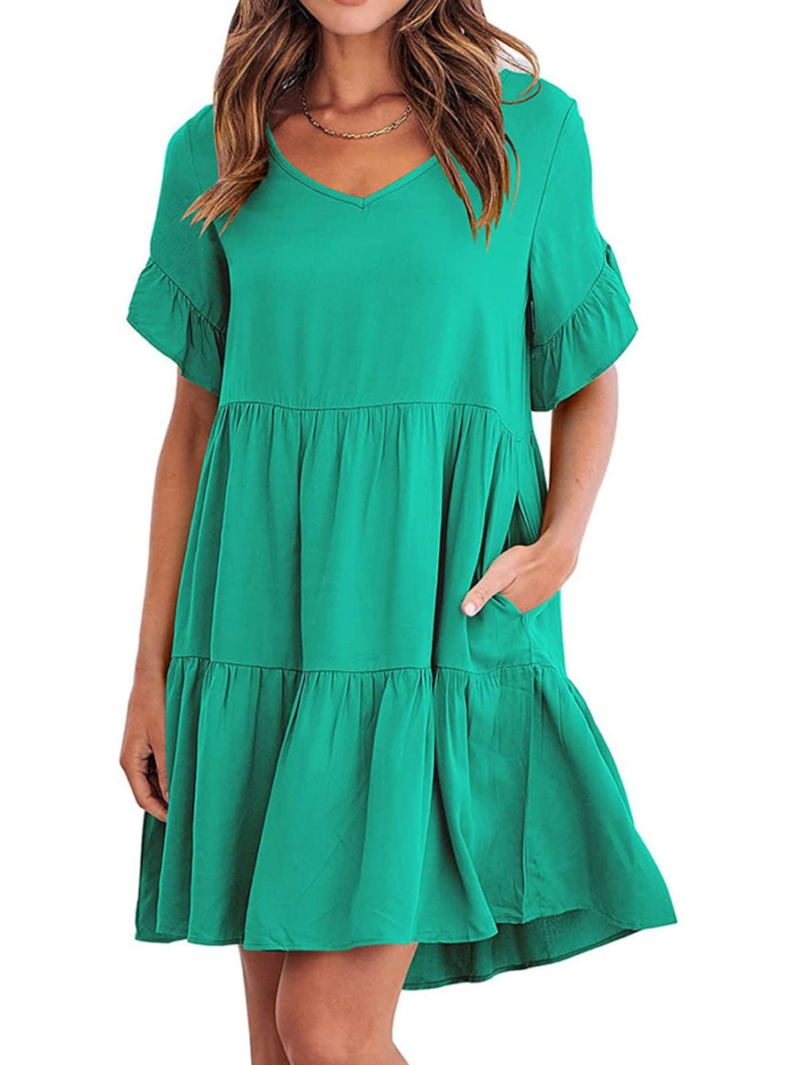 Emerald green tiered mini dress with ruffled sleeves and pockets