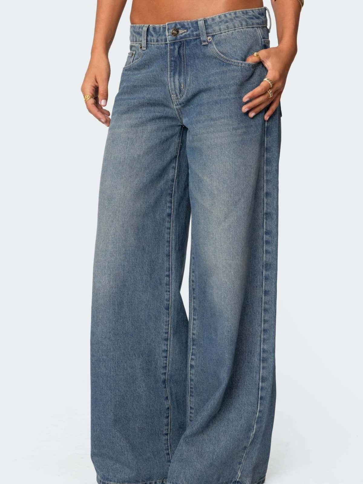 Dark blue wide leg denim jeans with button fly and classic five pocket styling.